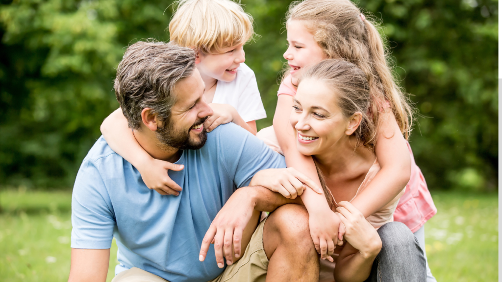 Smiling Canadian family spending time outdoors, representing the financial security offered by 10 Year Term Life Insurance