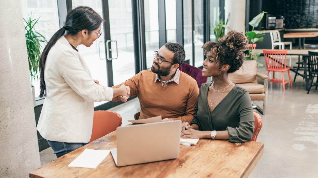 A couple talking to their agent about cheap life insurance Canada