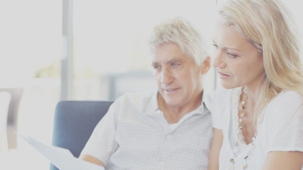 Canadian couple reviewing life insurance documents