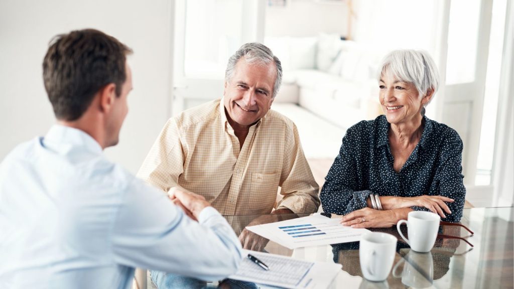 Canadian couple reviewing estate planning options with Term 100 life insurance coverage