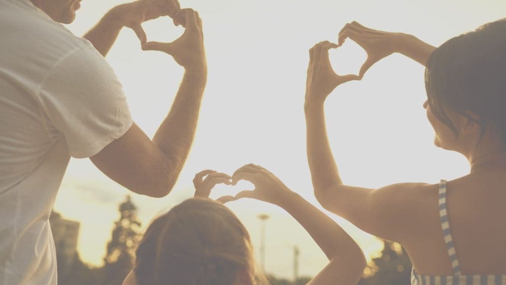 Family on a beach covered by Term Life Insurance