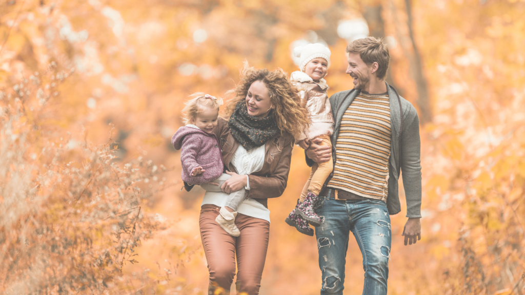 Couple hiking with their children knowing they are covered by No Medical Exam Life Insurance Canada | TermCanada