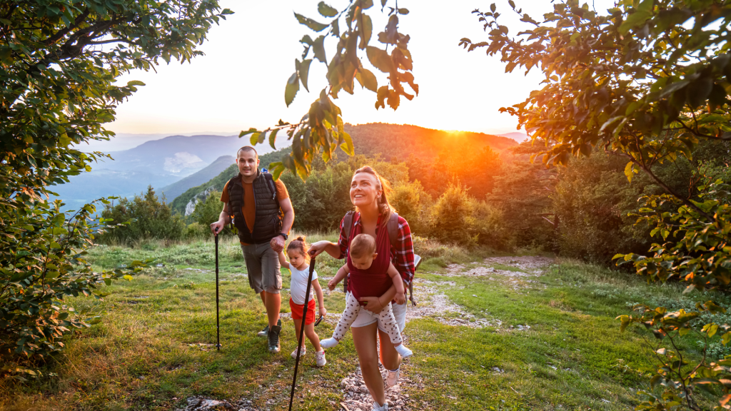 Canadian family hiking with children in nature, symbolizing protection and freedom through simplified life insurance Canada
